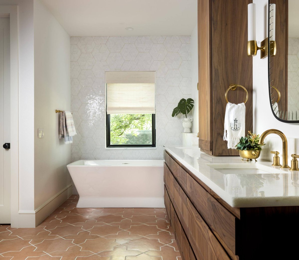 Contemporary bathroom with geometric tiles and a wall-mounted mirror, custom home by Sardone  McClain in Dallas, Texas