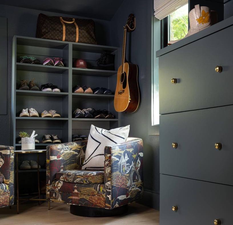 Cozy closet space with open shelving and colorful chairs, custom home by Sardone  McClain in Dallas, Texas