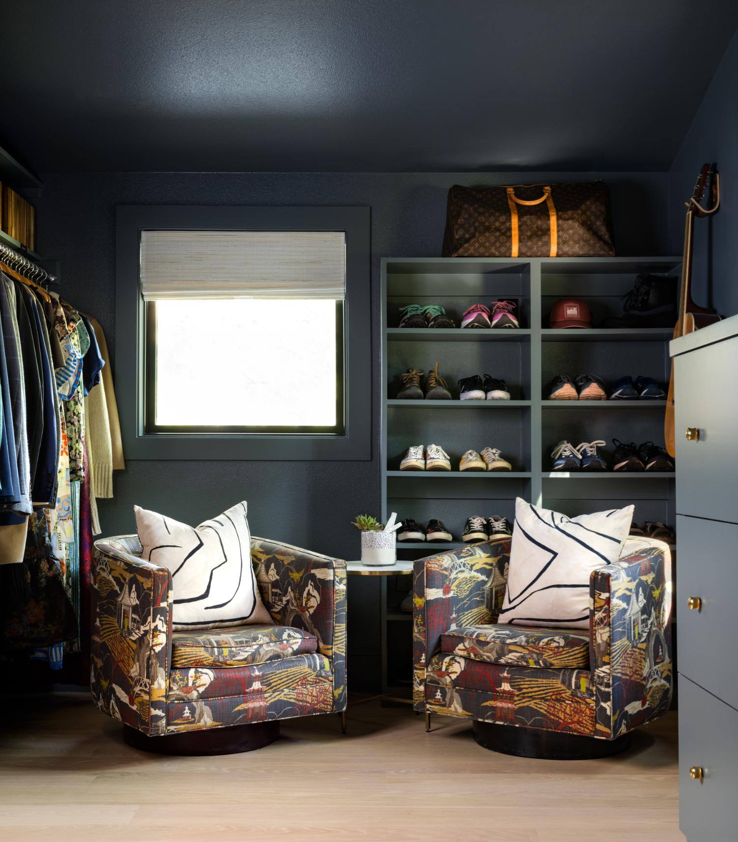 Walk-in closet with colorful chairs and shoe storage, custom home by Sardone  McClain in Dallas, Texas