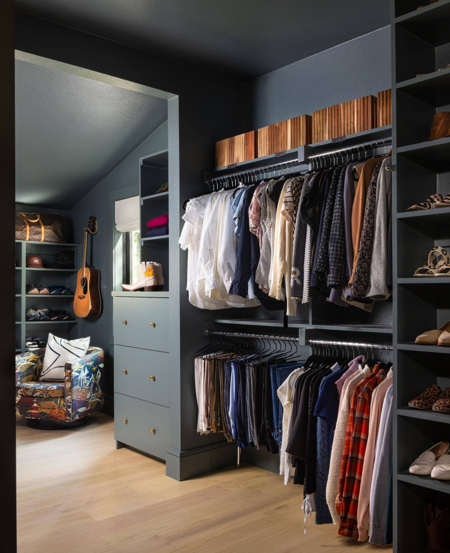 Walk-in closet with organized clothing and shoe storage, custom home by Sardone  McClain in Dallas, Texas