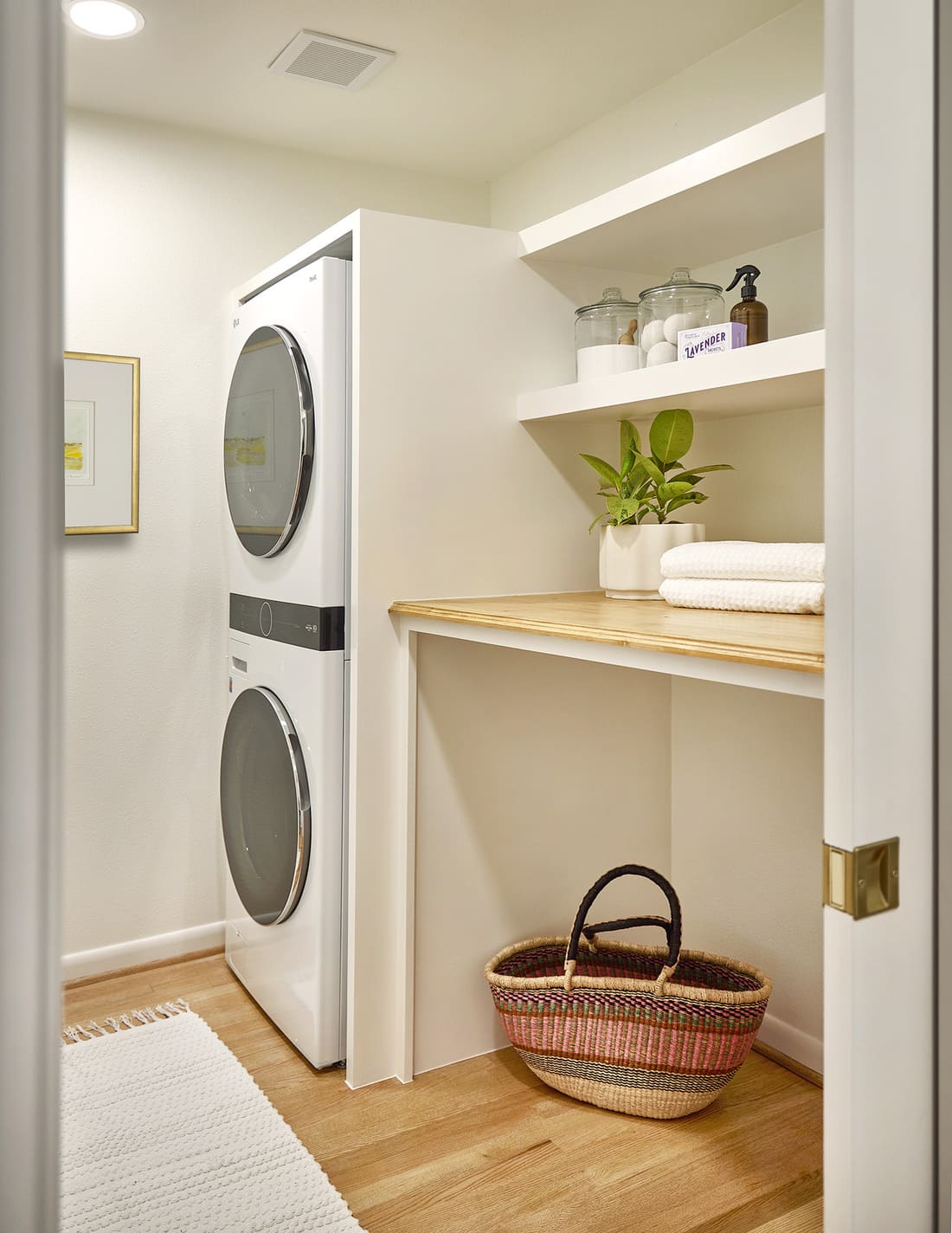 Laundry room with shelving in Dallas home remodel by Sardone | McLain