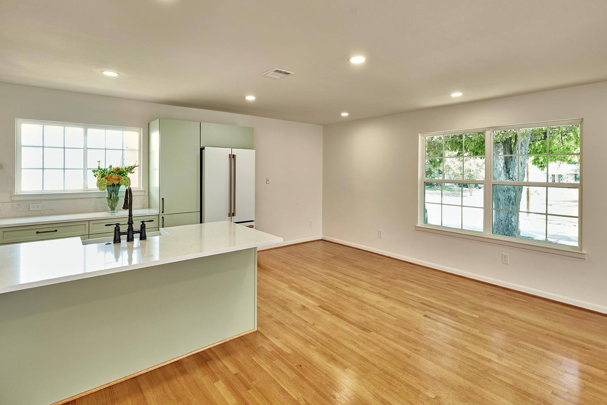 Bright kitchen remodel with island and sink by Sardone | McLain in Dallas