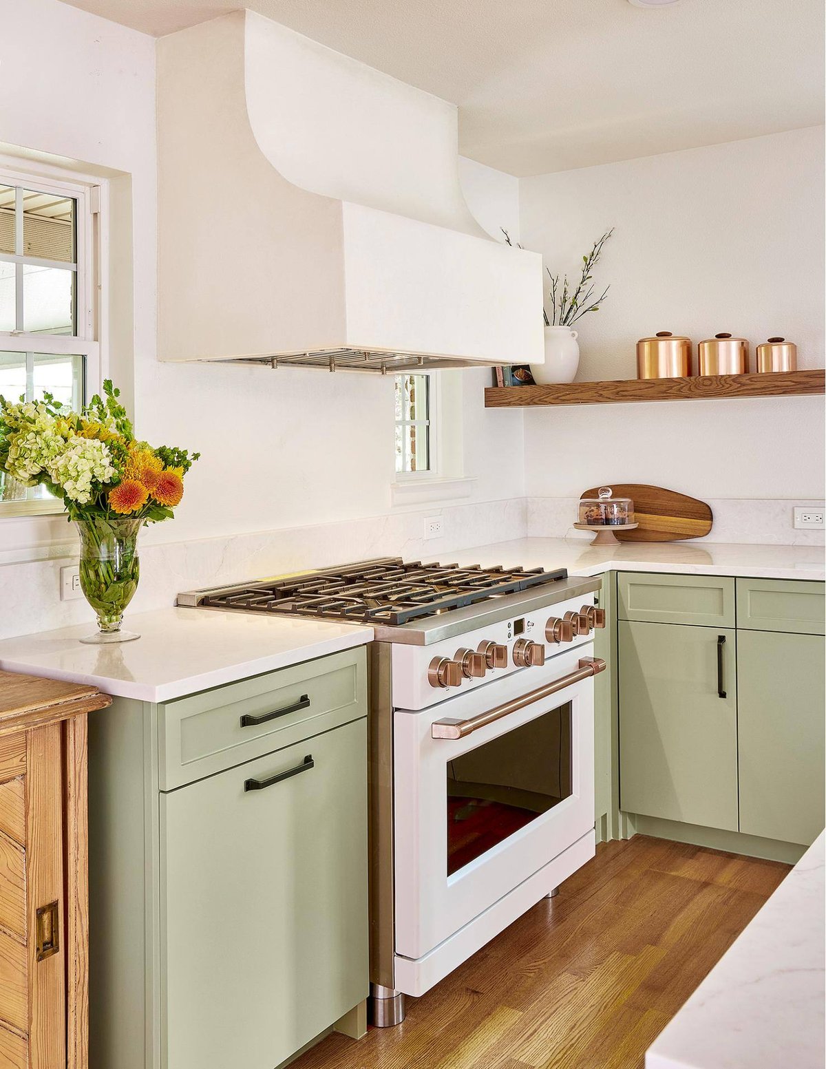 Custom white range hood and green cabinetry in Sardone | McLain kitchen remodel, Dallas, TX