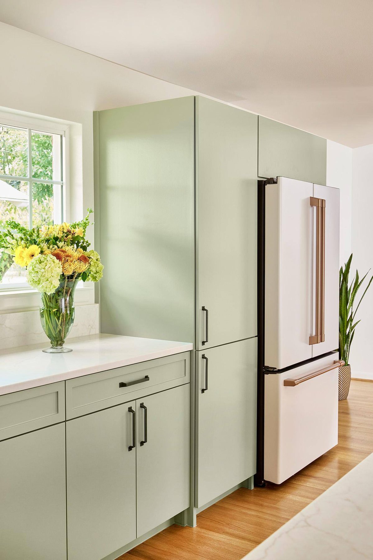 Flower vase on countertop next to refrigerator in Sardone | McLain kitchen remodel in Dallas, TX