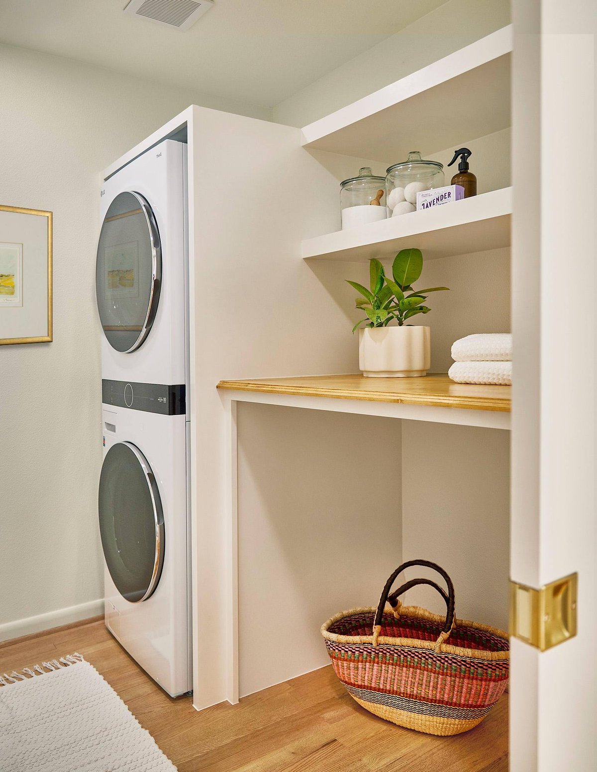 Laundry room with stacked washer and dryer in Sardone | McLain remodel, Dallas, TX