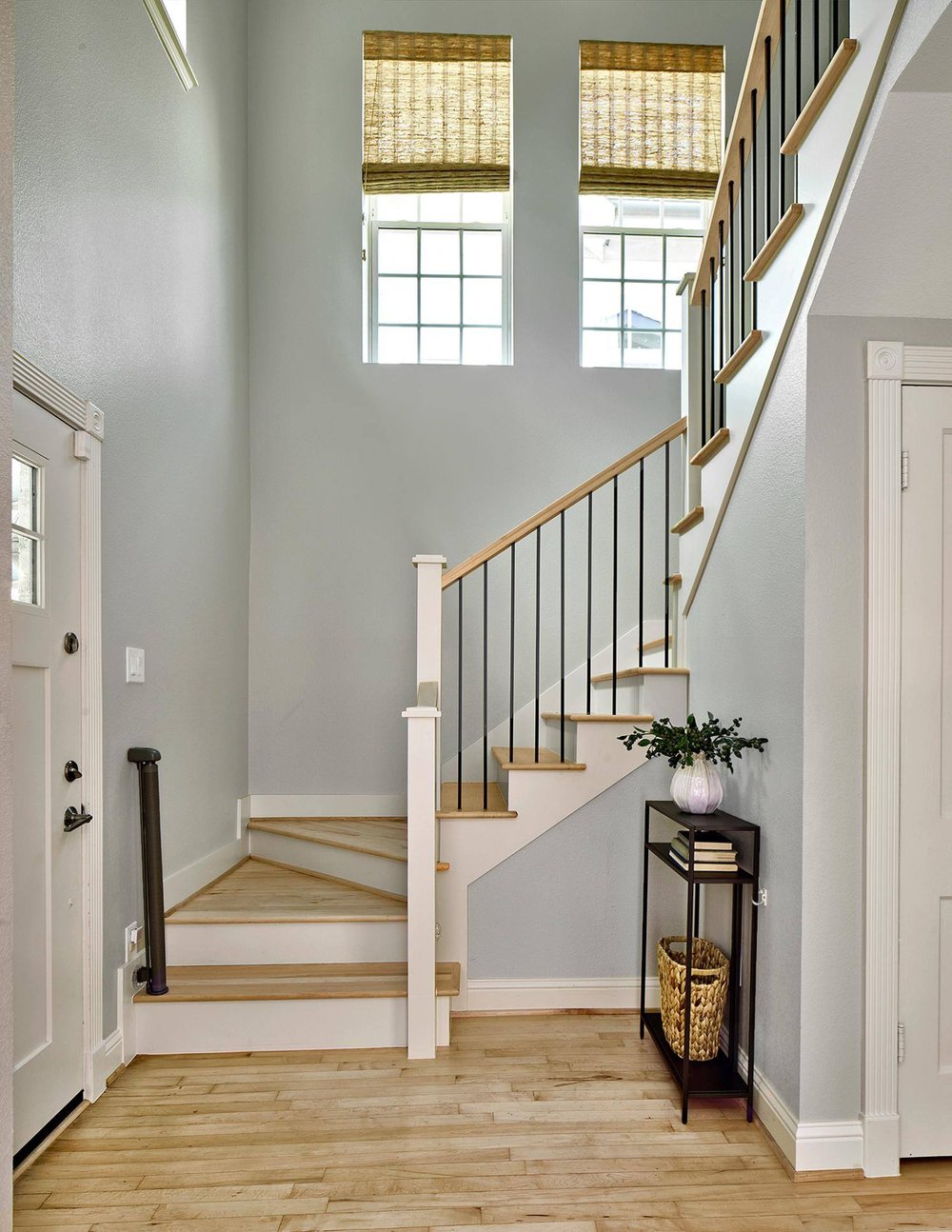 Entryway with staircase in Dallas home remodel by Sardone | McLain