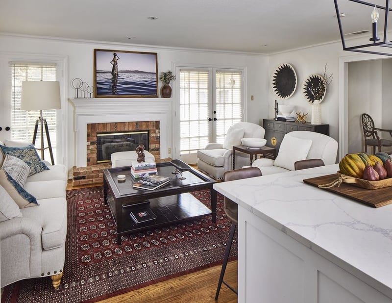 Den on first floor or Dallas, TX home remodel by Sardone | McLain with fireplace and white French doors to outside