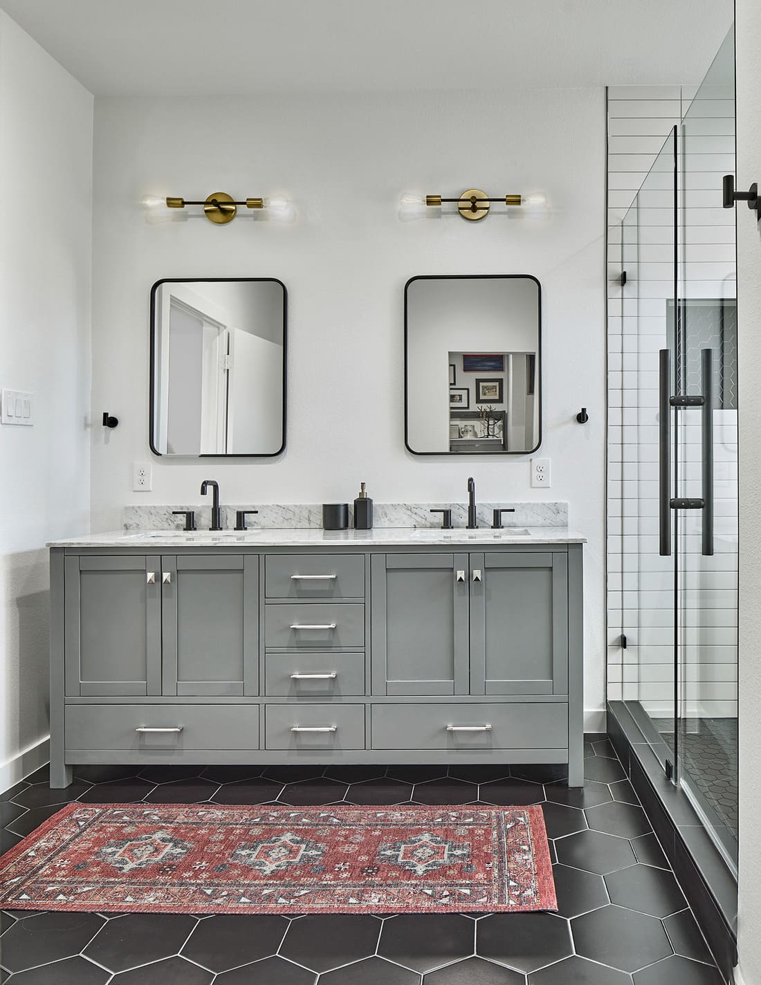 Double vanity in Dallas bathroom remodel with black faucet fixtures by Sardone | McLain