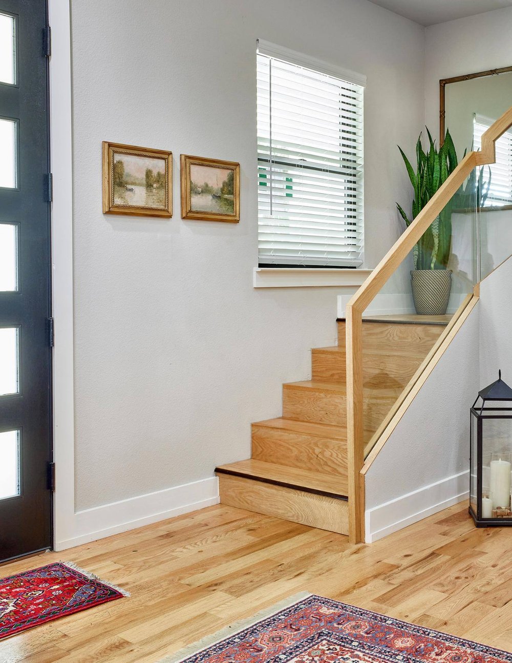 Front staircase in Dallas home remodel by Sardone | McLain in Dallas, TX