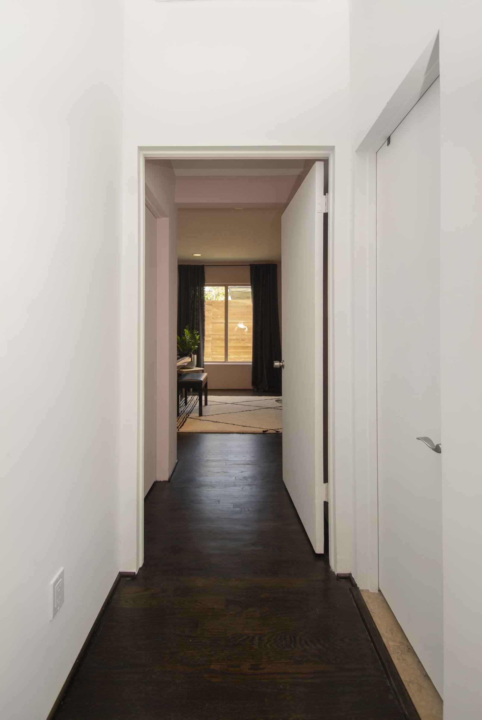 Home remodel with view of hallway to bedroom in Dallas, TX by Sardone | McLain