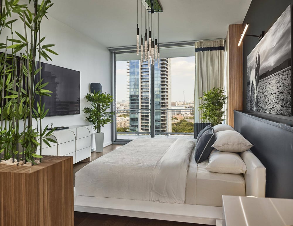 Dallas condo primary bedroom remodel with floor-to-ceiling window by Sardone | McLain