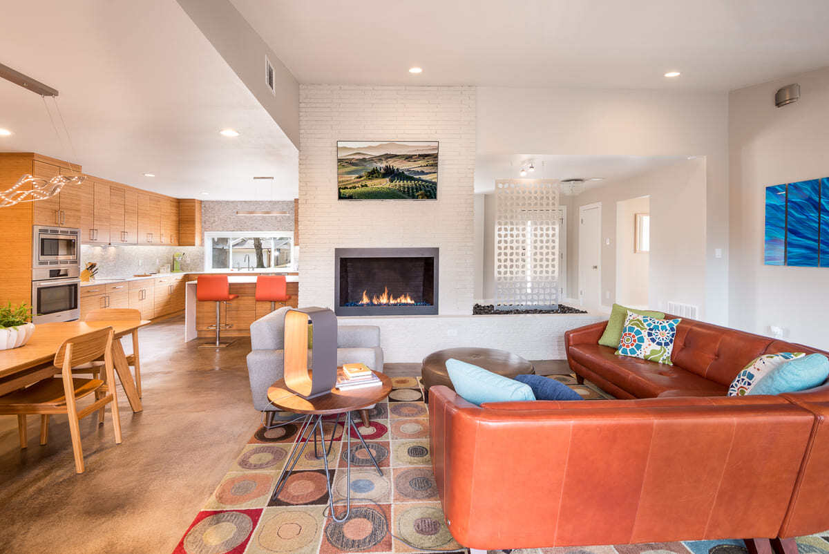 Mid-century modern living room remodel with fireplace in Dallas by Sardone | McLain