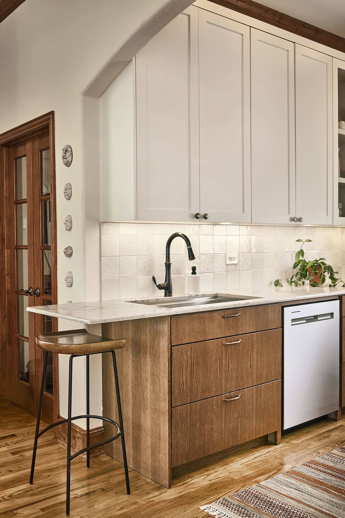 Kitchen remodel with two-tone cabinets and under mount sink in Dallas, Texas by Sardone | McLain