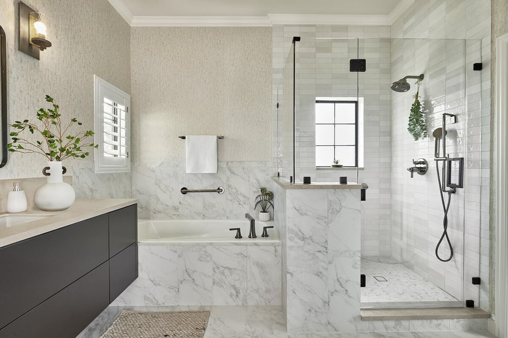 North Dallas bathroom remodel with tub and walk-in shower with black faucet features by Sardone | McLain