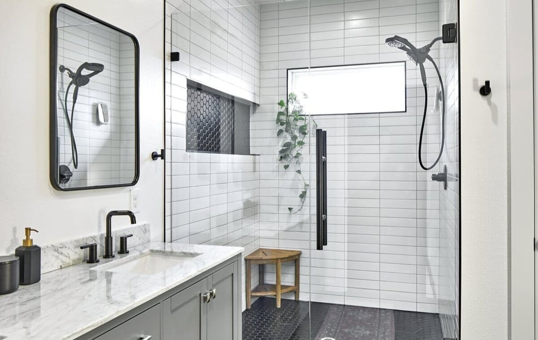 Walk-in shower in Dallas, TX bathroom remodel by Sardone | McLain with black fixtures