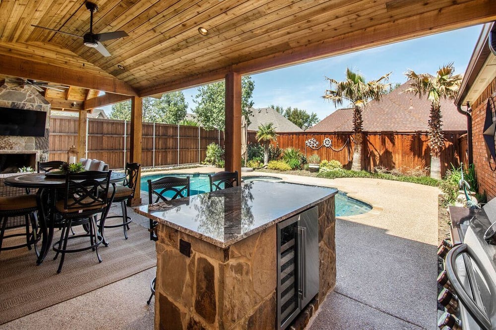 Dallas outdoor covered patio with beverage fridge in island by Sardone | McLain