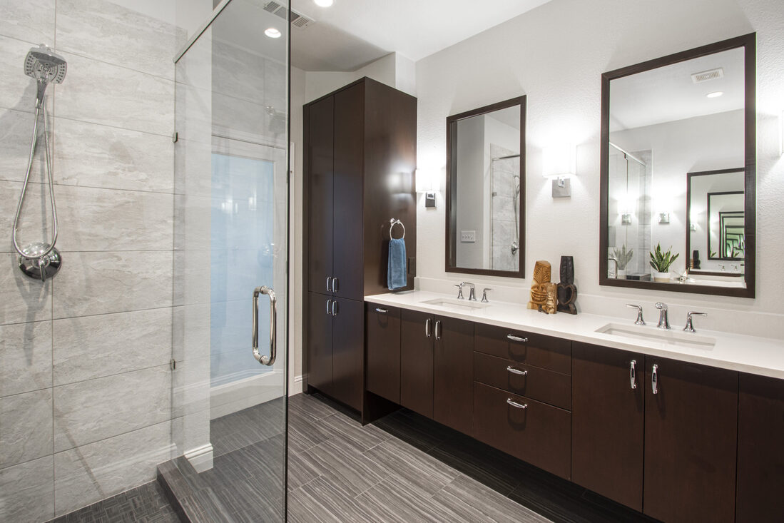 Double vanity in front of walk-in shower with glass door in Dallas, Texas home remodel by Sardone | McLain