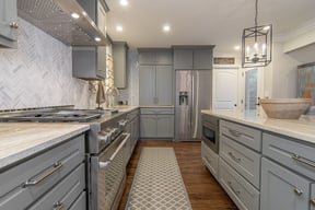 Gray kitchen remodel in Preston Hollow, TX with herringbone backsplash