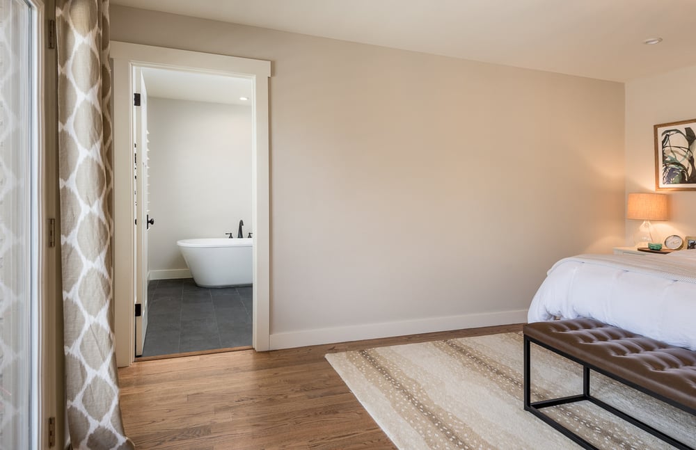 Primary suite addition in Dallas, TX with door opening to bathroom