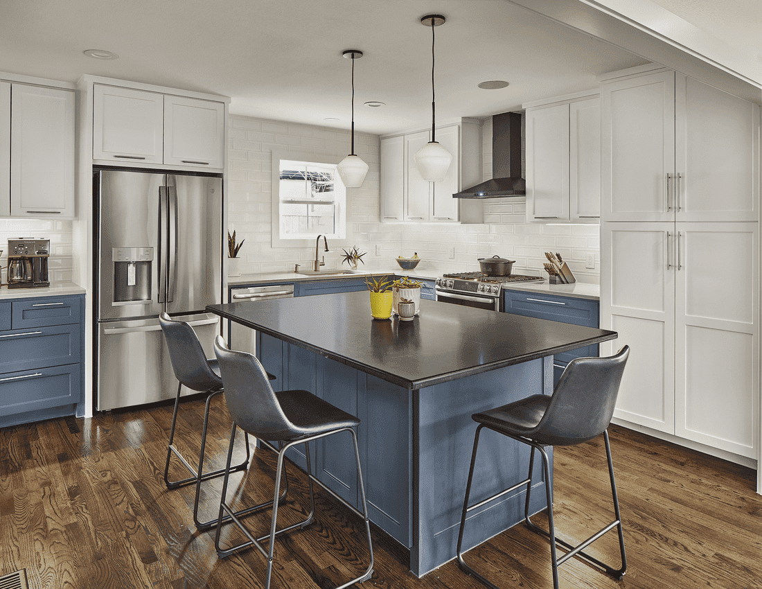 Two-tone blue and white kitchen remodel with island and seating in Dallas by Sardone | McLain