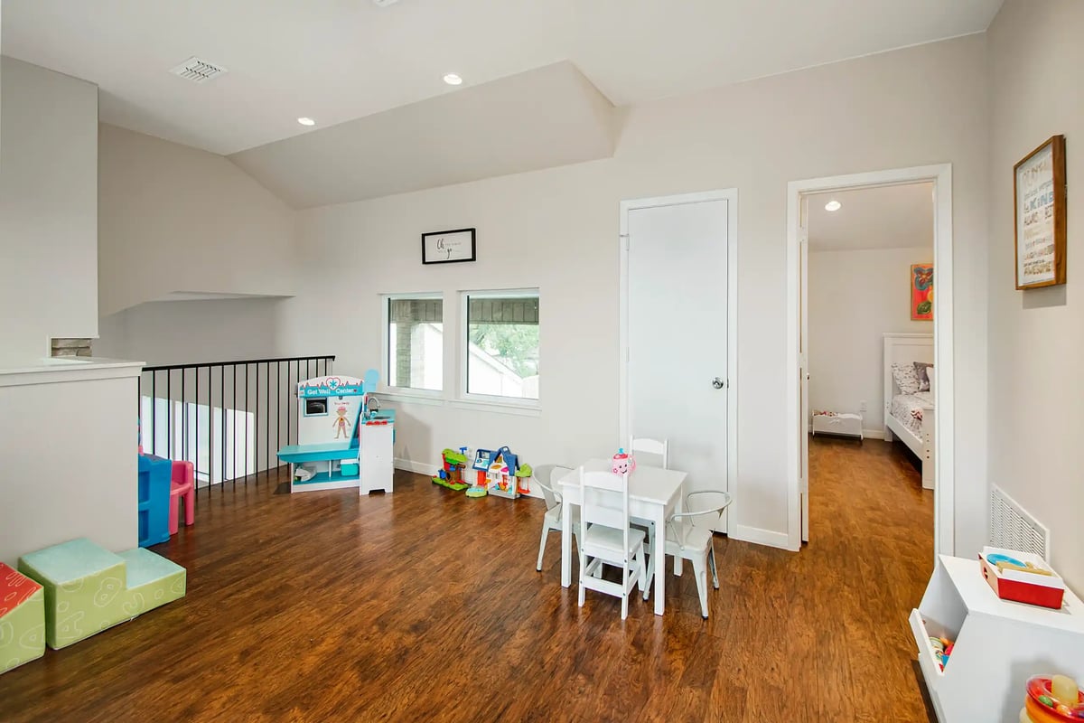 Second-story home addition play area in Dallas, TX with hardwood flooring